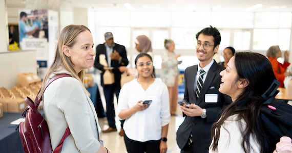 Students chat with a physician at a networking lunch following the Drexel Maternal and Child Health Symposium